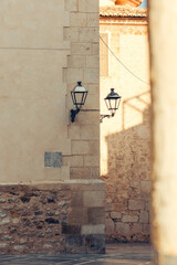 La Vila Joiosa details. Fragment of old building with vintage lantern in Villajoyosa in Spain