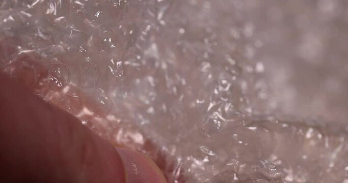 old air cellophane with a lot of bubbles for safe storage of things, close-up of a protective film with air bubbles