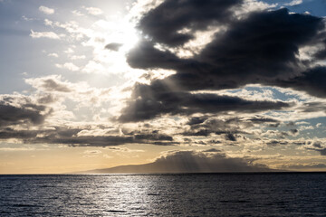 Dramatic sunset sky over the Pacific Ocean, Kamaole Beach Park II, tropical vacation paradise, Maui, Hawaii
