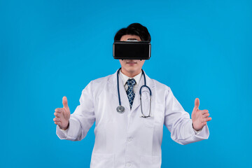 Doctor with stethoscope using VR holding research disease data against on blue background. Medical technology design for poster, banner and educational materials innovation 3D hologram. Contrivance.