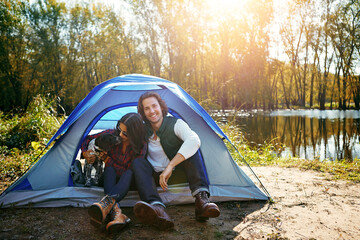 Couple, dog and camping by tent in nature for adventure, freedom and vacation or peace. People,...