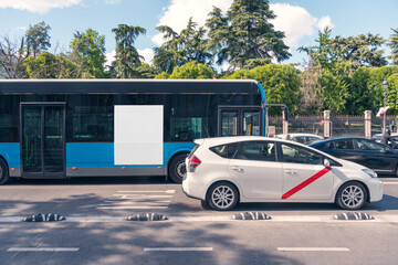 Madrid city bus with blank advertising space in urban setting