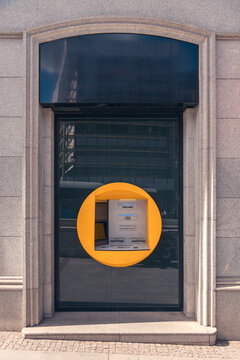 Madrid City ATM Machine in Bold Yellow Circle