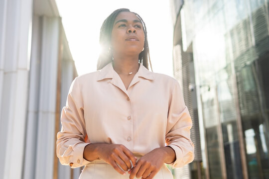 Confident businesswoman in Barcelona summer setting