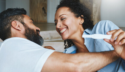 Fototapeta premium Couple, happy and pregnancy test for family, news and announcement for support and love in home. IVF, pregnant and wow for man and female person, surprise and maternity for celebration for fertility