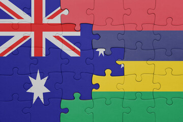 Obraz premium puzzle with the colourful national flag of mauritius and flag of australia.