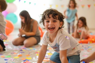 Joyful young boy laughing at a colorful birthday party, surrounded by balloons and playful decor.

