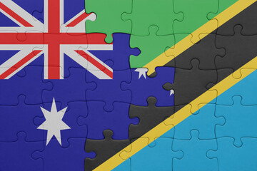 puzzle with the colourful national flag of tanzania and flag of australia.