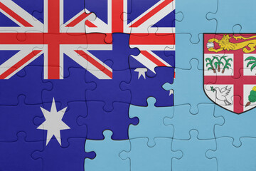 puzzle with the colourful national flag of Fiji and flag of australia.