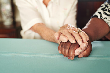 Holding hands, support and senior people with kindness, love and care at a retirement home with...