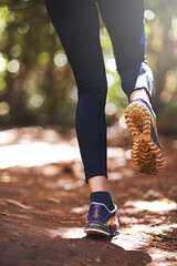Shoes, runner or person running on trail in nature on outdoor adventure to explore in terrain...