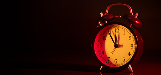 Five minutes to midnight on retro analog clock