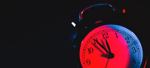 Five minutes to midnight on retro analog clock
