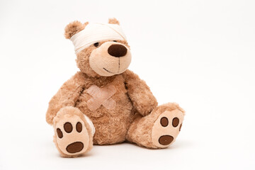 Teddy bear with dressing on white background
