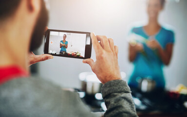 People, cooking and video with phone in kitchen for photography of woman with healthy food. Film,...