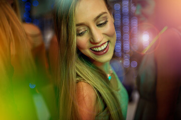 Dancing, smile and woman in nightclub for, music or happy weekend at social event. Nightlife,...