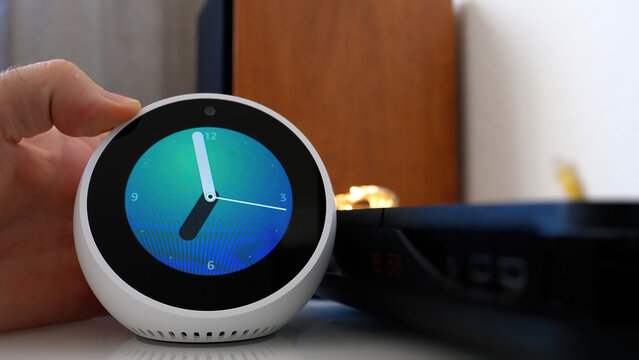 Paris, France - Jun 5th, 2020: The Amazon Echo Spot shows a clock on its screen, featuring a clean and modern interface