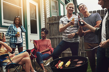 Friends, happy and cheers in backyard with bbq for social event, party and celebration with beer in garden. Group, drinking alcohol and food with relax, conversation or diversity at barbecue reunion