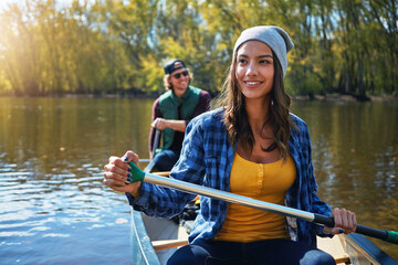 Lake, canoe and couple with nature, love and happiness with romance, relationship or bonding...