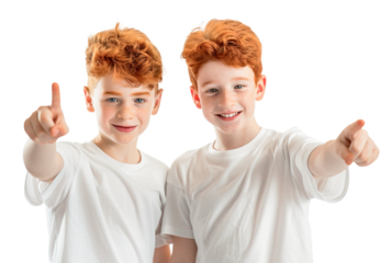 Two red hair twin boys wearing white t-shirts and pointing with finger at camera. Isolated over transparent background