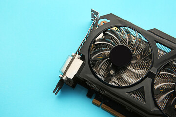 One graphics card on light blue background, top view. Space for text