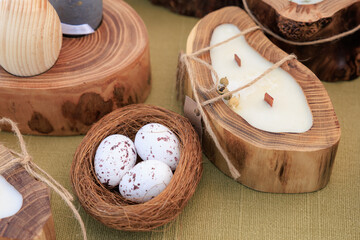 A wooden bowl with three eggs in it sits on a table
