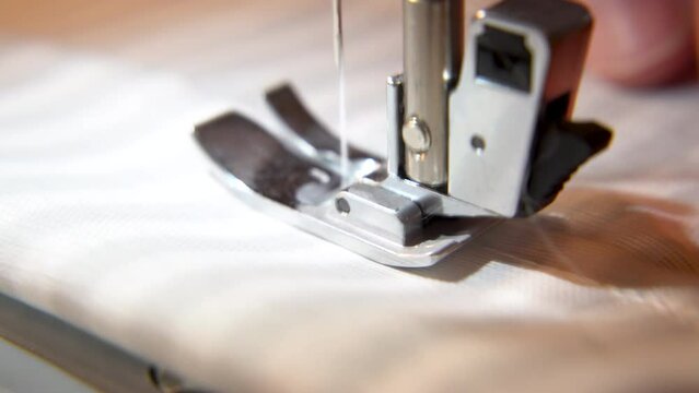close up of a sewing machine making a long stitch