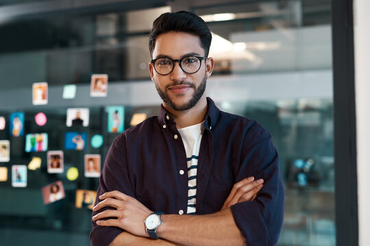 Business man, portrait and arms crossed in office with sticky notes for brainstorming, mind map and plan. Confident male person or young creative director with headshot on transparent wall for agency
