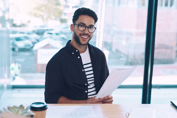 Creative, man and portrait of editor in office with happiness and confidence on magazine project. Manager, smile and person with review of writing, article or development of publication or editing