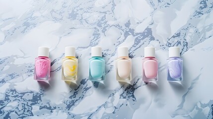 Nail polish on pastel colors on marble background
