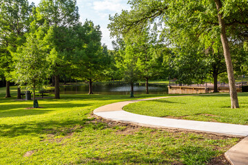 Green lawn and pond in Crowley Park in Richardson, Texas