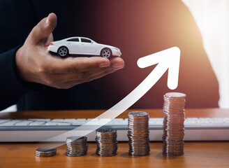 Car buying, insurance concept, vehicle tax, profit from sales concept. Big rising arrow on coin...