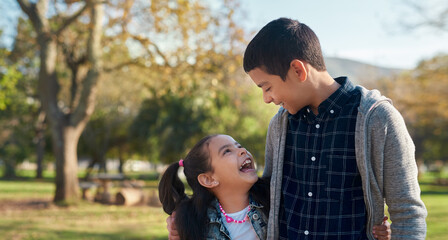 Happy, children and siblings on holiday at park for outdoor adventure, bonding and fun at countryside. Playful, girl and boy with smile in nature for summer vacation, carefree and joy in childhood