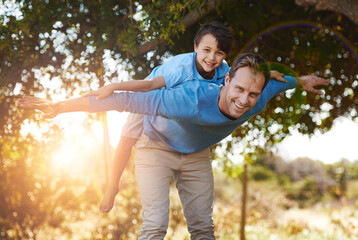 Portrait, dad and happy kid with airplane game at park for love, care or family bonding together in nature. Smile, father and piggyback child for support, flare and play on summer holiday for freedom