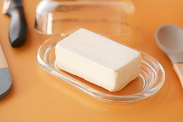fresh butter in a glass jar on table 