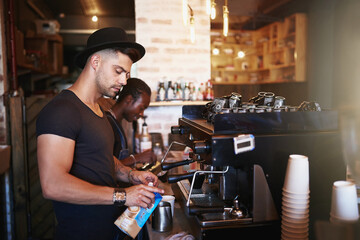 Barista, coffee shop and man in cafe with machine for serving caffeine, warm drinks and beverage....