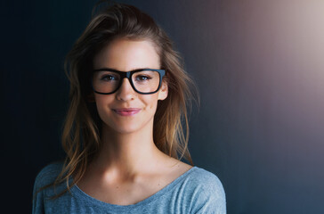 Studio, teenager or portrait of a girl for fashion, glasses or optometry with vision isolated on dark background. Style, happy or face of woman, mockup space or confident model with eyewear or smile