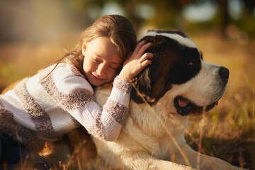 Girl, dog and hug in outdoor park for affection, friendship or cuddle pet in nature. Lens flare,...