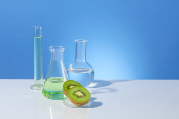 Frontal shot photography over blue background, measuring cylinder, boiling and erlenmeyer flask...