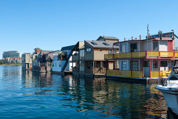 Colorful houseboats float in Victoria harbour at fisherman's wharf
