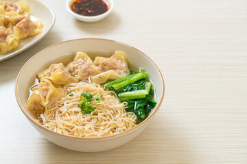 egg noodles with pork wonton soup or pork dumplings soup and vegetable
