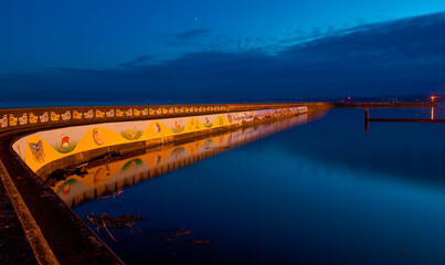 Colourful scene of the Victoria inner harbour breakwater a popular walking spot