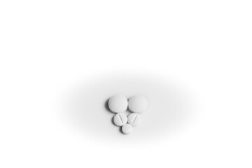 Five white generic pills arranged in a heart shape on white background.