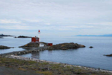 A Canadian lighthouse against the pacific ocean at Fort Rodd Hill in Victoria BC