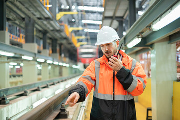 Railway maintenance engineers check readiness in the locomotive repair shop.