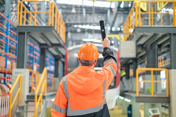 Portrait of a male engineer Take care of the electric locomotive maintenance shop