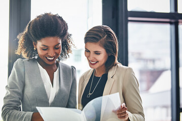 Business, women and happy in office with folder for teamwork, collaboration and growth as...