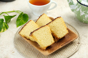 Classic Vanilla Sponge Cake with chocolate sprinkles as topping - (Bolu Jadul) on white background.