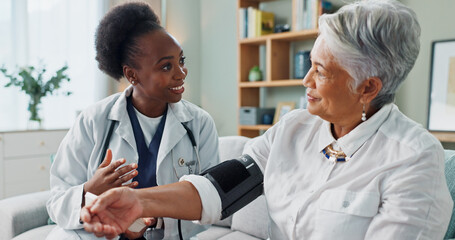 Elderly, woman and doctor with monitor for blood pressure with hypertension diagnosis, medical test...