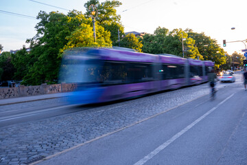 Purple line. Purple tram with motion blur on the Maximiliansbrücke Munich, Germany.